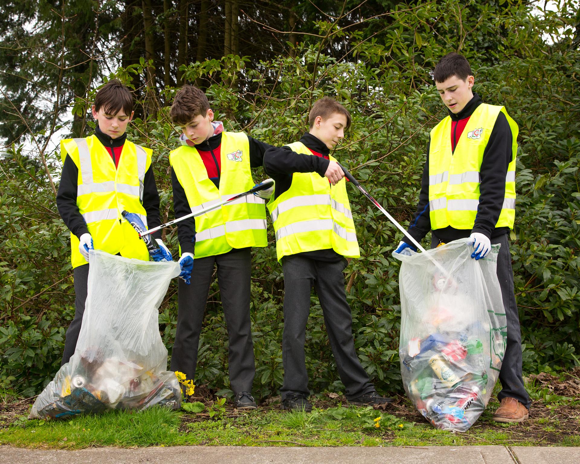 Four boys tidy up at St Munchins