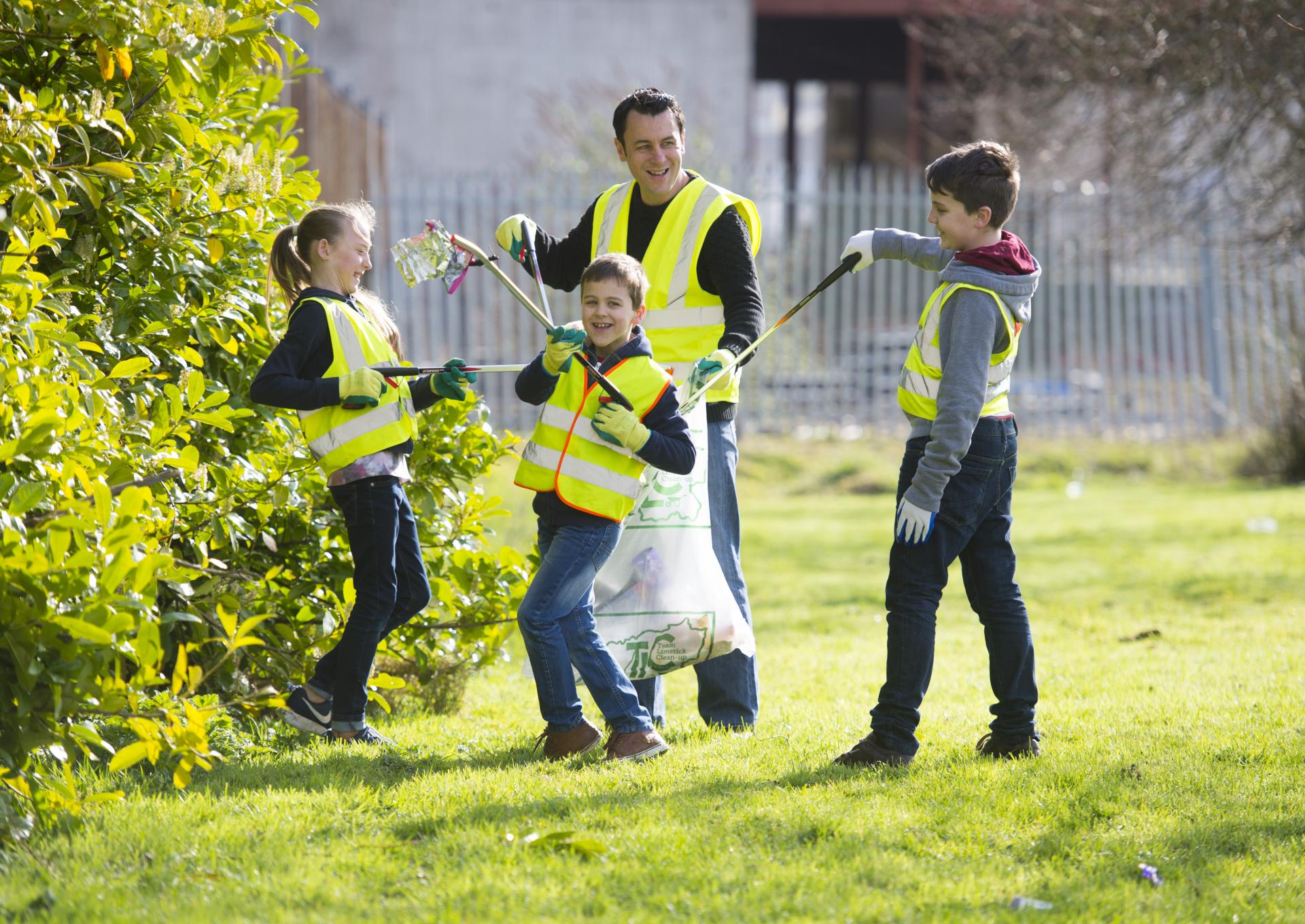 A man and three kids tidy up in Castletroy
