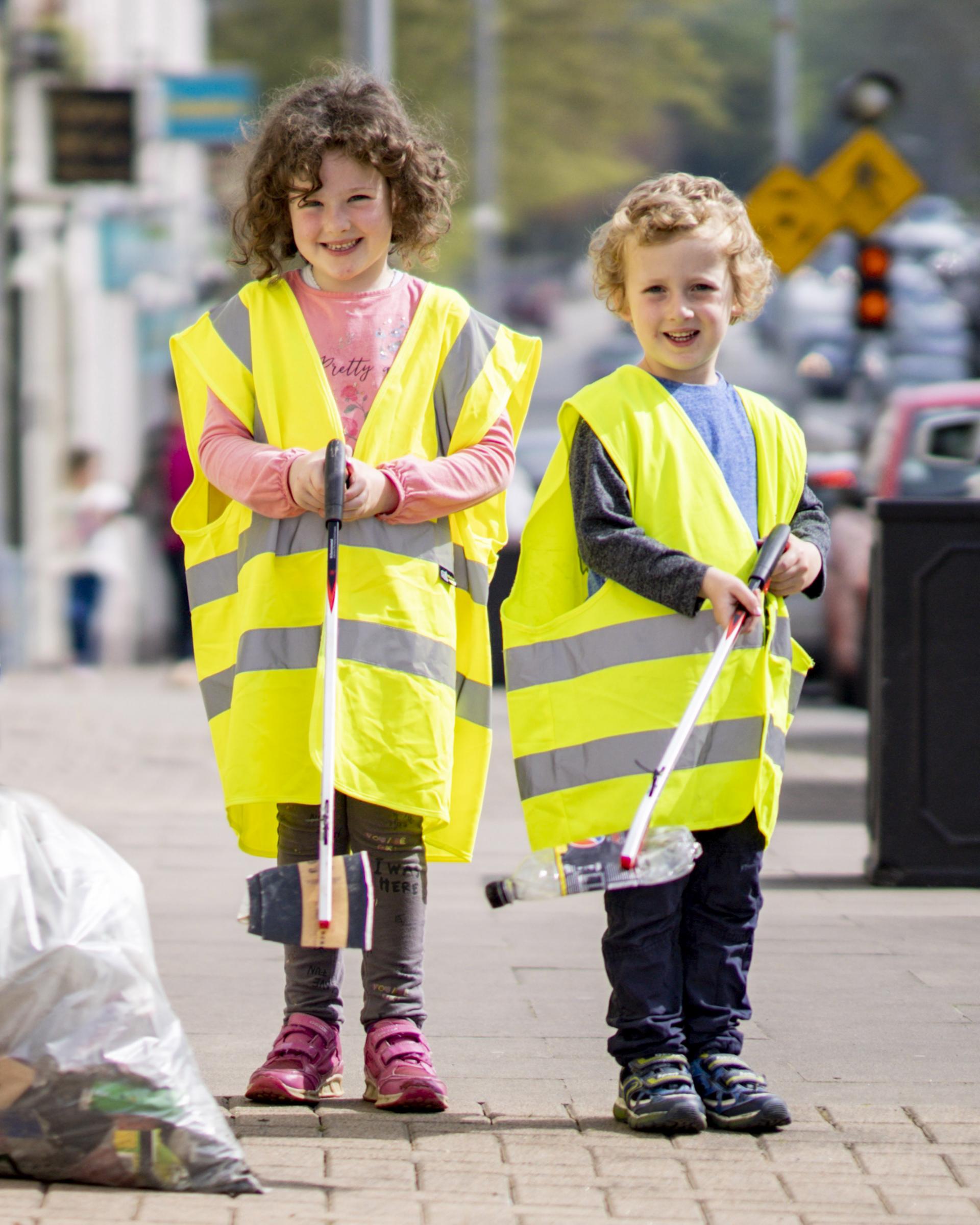 Two young kids pick litter off the streets of Limerick