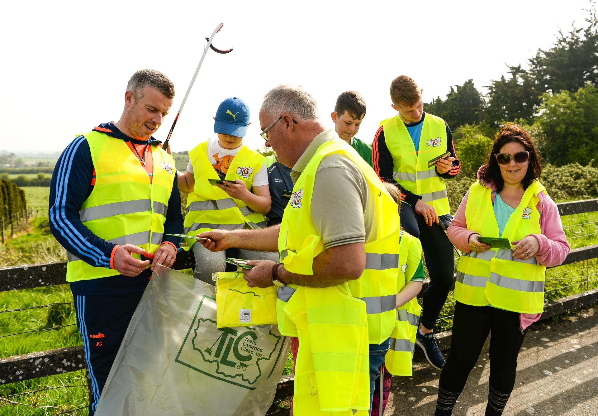 A group pick up litter at TLC5